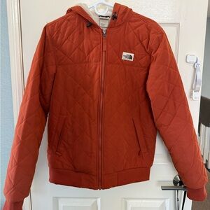 The North Face Men’s Cuchillo Insulated Zip Jacket with hood in Burnt Orange
